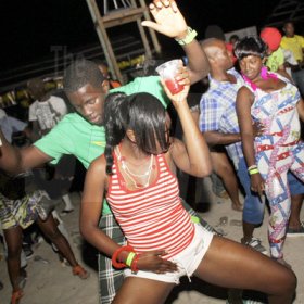 Anthony Minott/Freelance Photographer
These patrons getting down to some serious business during Chug it...the Soca Edition at Sugar Man's Beach, Hellshire, Portmore, St Catherine on Sunday, March 18, 2012. Over 8,000 patrons, mainly youngsters attended the party.
