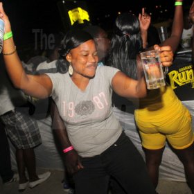 Anthony Minott/Freelance Photographer
She was feeling the party vibes during Chug it...the Soca Edition at Sugar Man's Beach, Hellshire, Portmore, St Catherine on Sunday, March 18, 2012. Over 8,000 patrons, mainly youngsters attended the party.