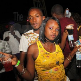 Anthony Minott/Freelance Photographer
A couple strike a pose during Chug it...the Soca Edition at Sugar Man's Beach, Hellshire, Portmore, St Catherine on Sunday, March 18, 2012. Over 8,000 patrons, mainly youngsters attended the party.
