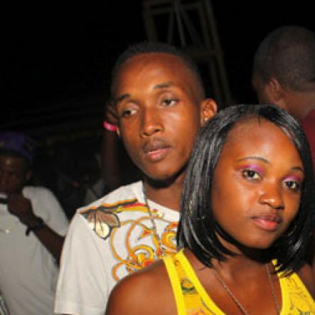 Anthony Minott/Freelance Photographer
A couple strike a pose during Chug it...the Soca Edition at Sugar Man's Beach, Hellshire, Portmore, St Catherine on Sunday, March 18, 2012. Over 8,000 patrons, mainly youngsters attended the party.