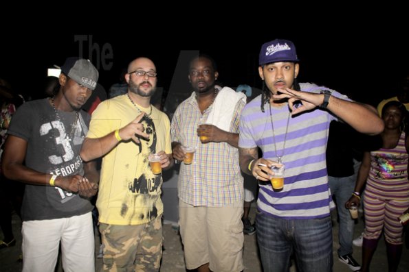 Anthony Minott/Freelance Photographer
A male crew came to show their support for RumBar Chug it held at Sugarman's Beach, Hellshire, Portmore, St Catherine on Sunday, April 8, 2012. Despite a heavy downpour in the evening hours over 8,000 patrons still made the trek to the award-winning party series.