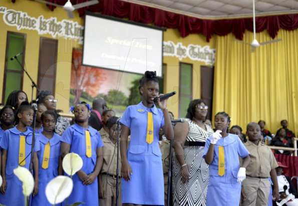 Gladstone Taylor/ Photographer<\n><\n>Students of Dunrobin Primary School perform a musical tribute<\n><\n>funeral service for the life of Annmarie Elliott-Nesbeth held at the new life assembly of God in kingston on saturday march 12, 2016