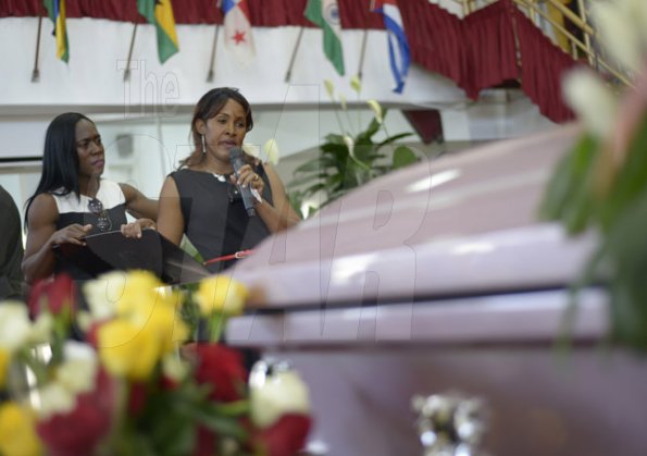 Gladstone Taylor/ Photographer

Samantha Henry Robbinson (Aunt) shows support as Mother Donna Wedderburn Allen (right) pays tribute to her daughter at the funeral service for the life of Annmarie Elliott-Nesbeth held at the new life assembly of God in kingston on saturday march 12, 2016