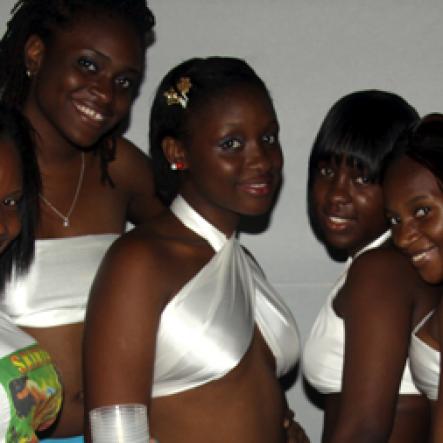 Anthony Minott/Freelance Photographer
Skintasy girls pose for the camera during 'Skintasy Chic', wet & wild beach party held at the Boardwalk Beach in hellshire on Sunday, July 25, 2010.