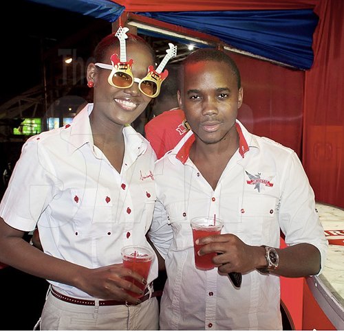 Contributed                                                                                                                                                                  Smirnoff brand manager, Safia Cooper (left) and Kamal Powell were taking in the most querky elements of the Smirnoff Nightlife Exchange project launch in Half Way Tree recently.
