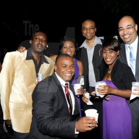 Rudolph Brown/Photographer
Standing in the back from left are Jawara Stewart, Vivia Taylor, Edward Taylor, Nicholas walker in front Linval Salmon and Kisha Walker at Smirnoff Exclusive at Chateau Xclusive, 3 Cherry Drive, Cherry Gardens on New Years Eve Friday, December 31-2010