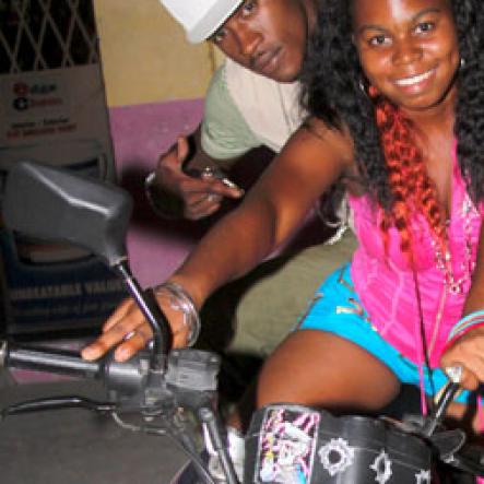 Anthony Minott/Freelance Photographer
Upcoming artiste Dayshanel pose on a bike with dancer Shelly Belly during DJ Spice birthday bash at Bayside, Portmore, St Catherine on Friday, August 6, 2010.