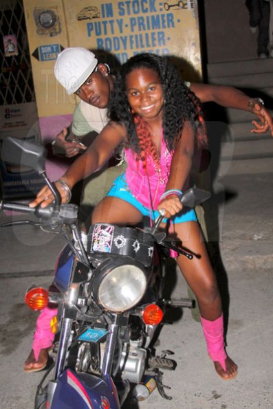 Anthony Minott/Freelance Photographer
Upcoming artiste Dayshanel pose on a bike with dancer Shelly Belly during DJ Spice birthday bash at Bayside, Portmore, St Catherine on Friday, August 6, 2010.