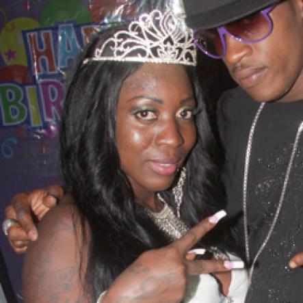 Anthony Minott/Freelance Photographer
DJ Spice (left), pose with dancer Shelly Belly during her birthday bash at Bayside, Portmore, St Catherine on Friday, August 6, 2010.