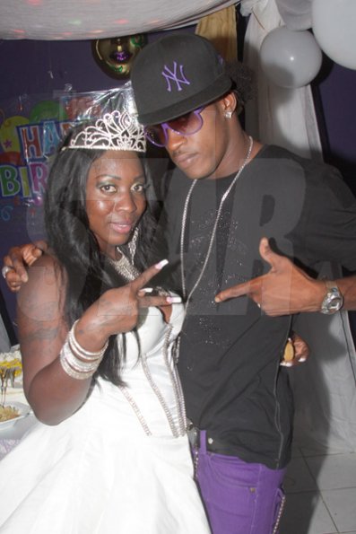 Anthony Minott/Freelance Photographer
DJ Spice (left), pose with dancer Shelly Belly during her birthday bash at Bayside, Portmore, St Catherine on Friday, August 6, 2010.