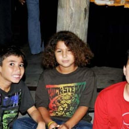 Grandsons of Reggae Sumfest executive director, Johnny Gourzong make themselves comfortable at the launch Red Stripe's western Jamaica launch in Montego Bay on Thursday night. From left are: Zane Gourzong, Adrian and Logan Wright.