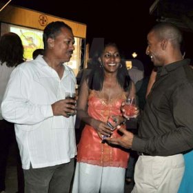 Photo by Janet Silvera
From left: Sponsors Secrets Resorts and Spa's Delwin Rochester, Caulette Mornan-Green and Round Hill's Omar Robinson at the Reggae Sumfest western Jamaica launch party at Pier One in Montego Bay on Thursday night.