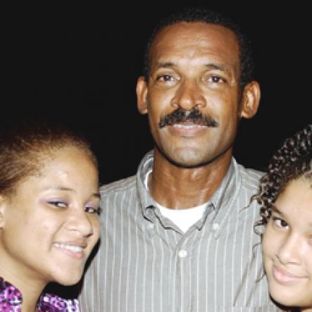 Winston Sill / Freelance Photographer
Capt. Errol Stewart celebrates  his 50th birthday with a grand swinging party, held at JDF Officers Club, Up Park Camp on Saturday night August 29, 2009. Here is the birthday boy Capt. Stewart and his two daughters,-- Brianne Stewart (left); and Kayla Stewart (right).