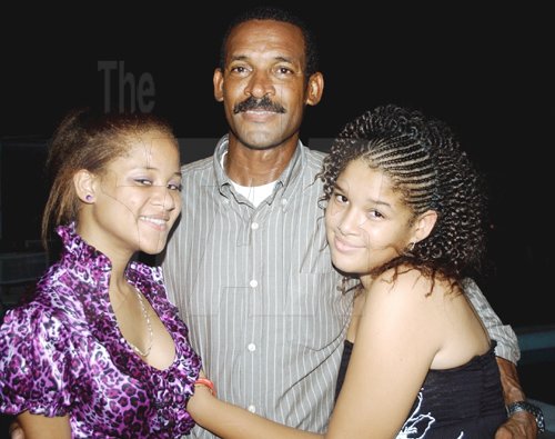 Winston Sill / Freelance Photographer
Capt. Errol Stewart celebrates  his 50th birthday with a grand swinging party, held at JDF Officers Club, Up Park Camp on Saturday night August 29, 2009. Here is the birthday boy Capt. Stewart and his two daughters,-- Brianne Stewart (left); and Kayla Stewart (right).