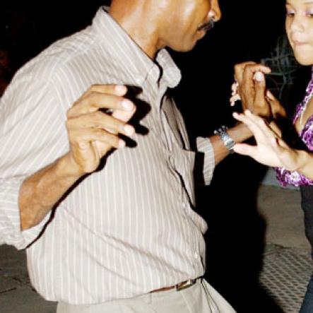 Winston Sill / Freelance Photographer
Capt. Errol Stewart celebrates  his 50th birthday with a grand swinging party, held at JDF Officers Club, Up Park Camp on Saturday night August 29, 2009. Here Here Capt. Stewart and daughter Brianne Stewart dancing up a storm.