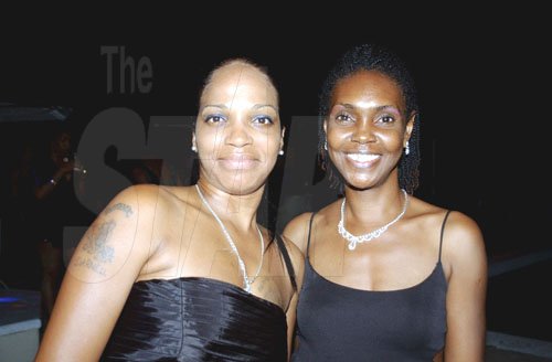 Winston Sill / Freelance Photographer
Capt. Errol Stewart celebrates  his 50th birthday with a grand swinging party, held at JDF Officers Club, Up Park Camp on Saturday night August 29, 2009. Here are Debbian Carney (left); and Paulette Wilson (right).
