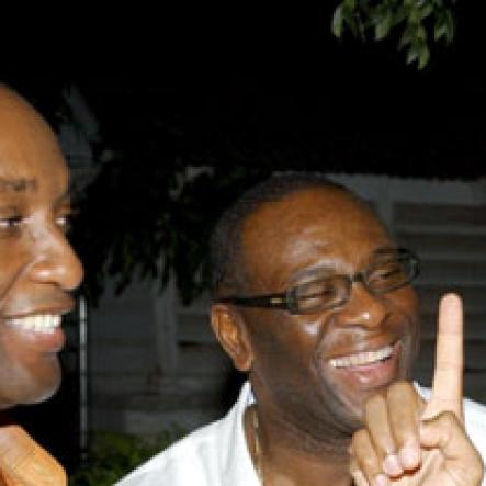 Winston Sill / Freelance Photographer
Capt. Errol Stewart celebrates  his 50th birthday with a grand swinging party, held at JDF Officers Club, Up Park Camp on Saturday night August 29, 2009. Here are Danovan Williams (left); Dwieght Moore (centre); and Kevin Sadler (right).