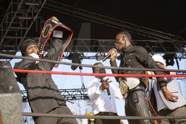 Anthony Minott

Kiprich (left) holds his new title belt high, after receiving the honour from Ninja Man (right), MC Nuffy handling the proceedings.