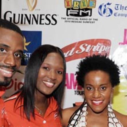 Contributed
Red Stripe's Star Performer Etana (second right) hangs out with Levaughn Flynn (left) and Safia Cooper of Red Stripe while Summerfest Productions director Robert Russell looks on during the launch of Reggae Sumfest on Friday night.