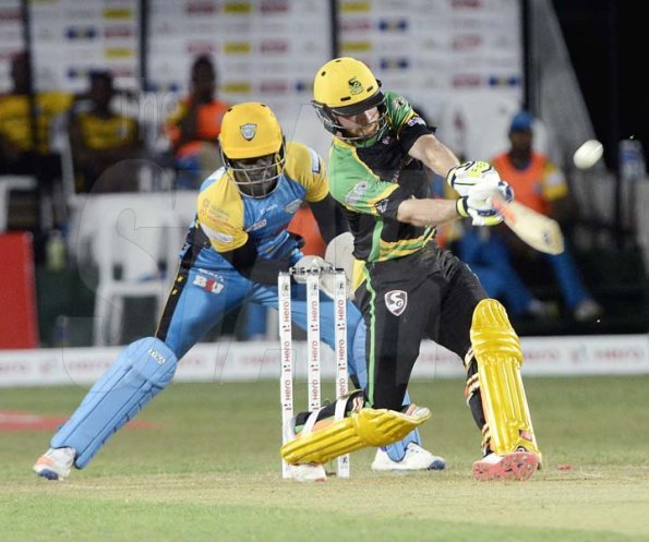 Ian Allen/PhotographerGlen Phillips hit for 6 during hte Jamaica Tallawahs run chase against the St.Lucia Stars at Sabina Park on Tuesday.Wicket Keeper is Andre Fletcher.
