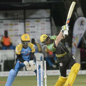 Ian Allen/PhotographerGlen Phillips hit for 6 during hte Jamaica Tallawahs run chase against the St.Lucia Stars at Sabina Park on Tuesday.Wicket Keeper is Andre Fletcher.