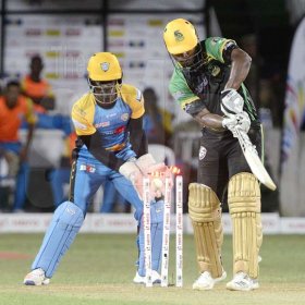 Ian Allen/PhotographerJamaica Tallawahs opening batsman Johnson Charles (right) is bowled by M. Hodge during the Tallawahs run chase of 175. Andre Fletcher is the wicketkeeper.