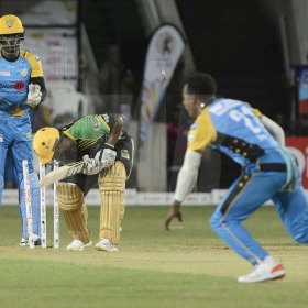 Ian Allen/PhotographerM. Hodge (right) from the St.Lucia Stars clelebrates  after he bowled Johnson Charles (center0 during the Jamaica Tallawahs run chase of 175. Andre Fletcher is the Wicket Keeper.