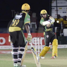 Ian Allen/PhotographerGlen Phillips (right) pulls for six during the Jamaica Tallawahs chase of 175 that was made by the St.Lucia Stars in their CPL t/20 match at Sabina Park. The non striker is Andre McCarthy.