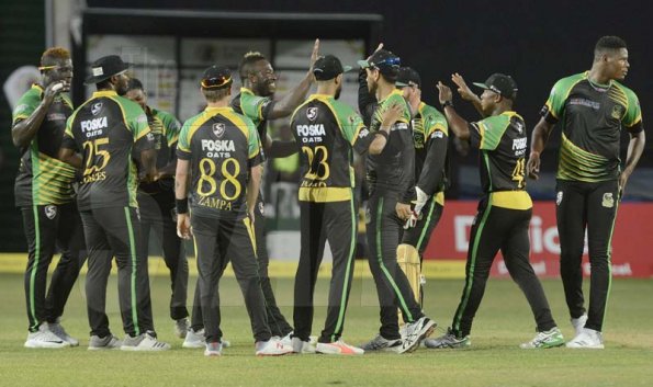 Ian Allen/PhotographerJamaica Tallawahs team celebrating the fall of a St.Lucia Stars wicket on Tuesday.