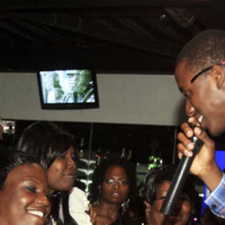 Romaine Virgo charms a young woman in the audience