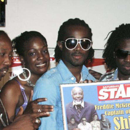 Photo by Anthony Minott
Freddie McGregor (left) takes a picture with The Big Ship family and a commemorative plaque he was given as tribute by THE STAR. From left are: Singing Sweet, Shema, Chino, Stephen 'Di Genius' McGregor, and Bramma.