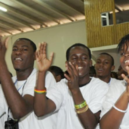 Ian Allen/Staff Photographer
Representatives from Barbados cheers during the  Antilles Episcopal Conference(AEC) 2009 Opening Ceremony at St. Georges College in Kingston on tuesday.