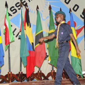Ian Allen/Staff Photographer
A Cadet march pass the flags of the different caribbean countries represented at the Antilles Episcopal Conference 2009 Opening Ceremony held at St. Georges College in Kingston on tuesday.