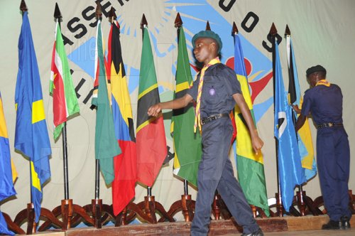 Ian Allen/Staff Photographer
A Cadet march pass the flags of the different caribbean countries represented at the Antilles Episcopal Conference 2009 Opening Ceremony held at St. Georges College in Kingston on tuesday.
