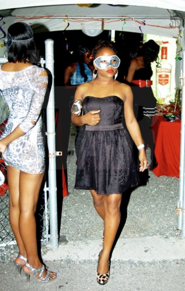 Winston Sill / Freelance Photographer
Her silver mask paired nicely with her little black dress.





DARK Entertainment and Smirnoff presents Twisted Spiritz Party, held at Palisadoes Go Kart Track on Saturday night May 17, 2010.