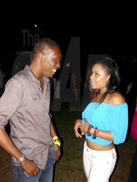 Contributed
Gareth Geddes, Brand Manager for Guinness chats with dancehall diva Cecille during the Bolt party 9.58 at Richmond Estate on Saturday night.
