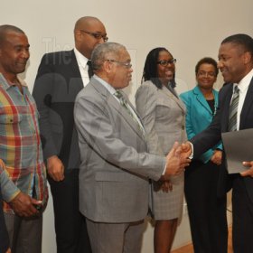 Jermaine Barnaby/Photographer
Launch for the symbolic planting of the first legal Marijuana Plant at the Lecture Theatre Two (2) , Faculty of Medical Sciences Teaching and Research Complex on Monday April 20, 2015.