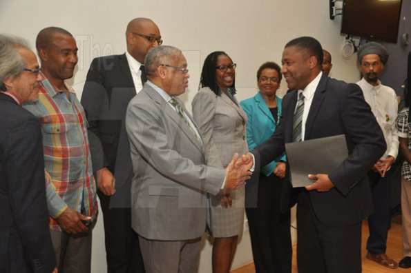 Jermaine Barnaby/Photographer
Launch for the symbolic planting of the first legal Marijuana Plant at the Lecture Theatre Two (2) , Faculty of Medical Sciences Teaching and Research Complex on Monday April 20, 2015.