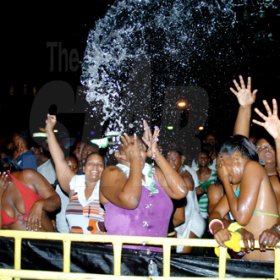 Winston Sill / Freelance Photographer
                                                                                   Patrons enjoying a little water at the official and original Water Party, held at Sagicor Car Park, New Kingston on Saturday night April 10, 2010.