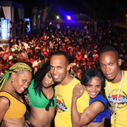 Anthony Minott/Freelance Photographer
Third from left Crishna Benson, Brand manager for Magnum Tonic Wine and Marlon Parnell C.E.O. of Surfaz Entertainment, promoters of the event, share lens with the Magnum Girls during the Magnum Wet Wet Xtreme Water Party at Ewarton Sports Complex, in St Catherine last Saturday.