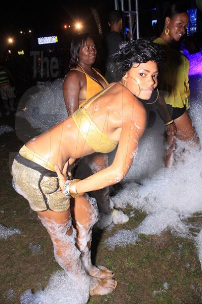 Anthony Minott/Freelance Photographer A sexy Diva pose inside the foam area during the Magnum Wet Wet Xtreme Water Party at Ewarton Sports Complex, in St Catherine last Saturday.