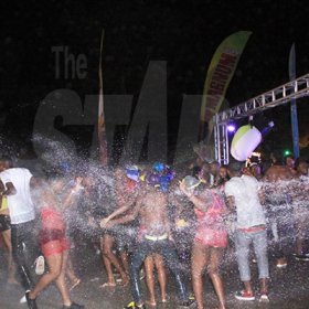 Anthony Minott/Freelance Photographer Patrons enjoy themselves as they are drenched with water during the Magnum Wet Wet Xtreme Water Party at Ewarton Sports Complex, in St Catherine last Saturday.