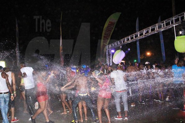 Anthony Minott/Freelance Photographer Patrons enjoy themselves as they are drenched with water during the Magnum Wet Wet Xtreme Water Party at Ewarton Sports Complex, in St Catherine last Saturday.