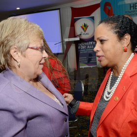 Rudolph Brown/Photographer
Kate Spring, (right) Country Director of UNAIDS chat with Dr Carolyn Gomes of the Caribbean Vulnerable Communities at the World AIDS Day breakfast Forum "Health for All: Towards A More Integrated Response to HIV Prevention, Treatment and Care, at the Knutsford Court Hotel on Tuesday, December 1, 2015