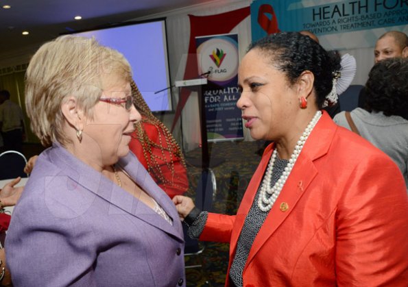Rudolph Brown/Photographer
Kate Spring, (right) Country Director of UNAIDS chat with Dr Carolyn Gomes of the Caribbean Vulnerable Communities at the World AIDS Day breakfast Forum "Health for All: Towards A More Integrated Response to HIV Prevention, Treatment and Care, at the Knutsford Court Hotel on Tuesday, December 1, 2015