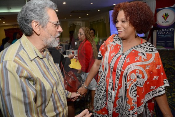 Rudolph Brown/Photographer
Taitu Heron, National Programme Coordinator, Jamaica of UN Women in discussion with Professor Peter Figueroa, of Public Health, University of the West Indies at the World AIDS Day breakfast Forum "Health for All: Towards A More Integrated Response to HIV Prevention, Treatment and Care, at the Knutsford Court Hotel on Tuesday, December 1, 2015