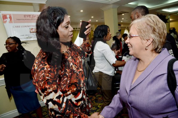 Rudolph Brown/Photographer
Transwoman Jessica Burton, (left) chat with Dr Carolyn Gomes of the Caribbean Vulnerable Communities at the World AIDS Day breakfast Forum "Health for All: Towards A More Integrated Response to HIV Prevention, Treatment and Care, at the Knutsford Court Hotel on Tuesday, December 1, 2015