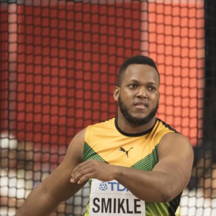 Traves Smikle competes in the discus throw event at the