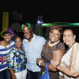 Winston Sill/Freelance Photographer
J. Wray and Nephew host Yardi Gras 2014 the annual Media Party, held at Countryside Club, Courtney Walsh Drive on Tuesday night March 18, 2014. Here are Naomi  Garrick (left); Sophia Bernard-Fairman (second left);       Colin Smith (centre); Debbie-Ann Spence (second right); and Greta Bogues (right).