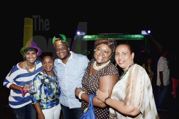 Winston Sill/Freelance Photographer
J. Wray and Nephew host Yardi Gras 2014 the annual Media Party, held at Countryside Club, Courtney Walsh Drive on Tuesday night March 18, 2014. Here are Naomi  Garrick (left); Sophia Bernard-Fairman (second left);       Colin Smith (centre); Debbie-Ann Spence (second right); and Greta Bogues (right).